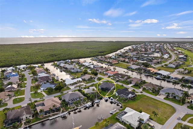 bird's eye view with a water view