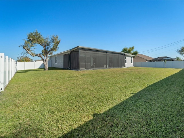 view of yard featuring a sunroom