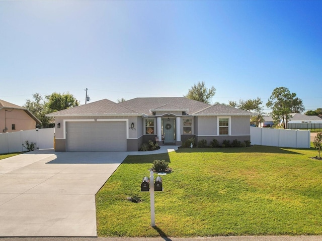 ranch-style house with a garage and a front yard