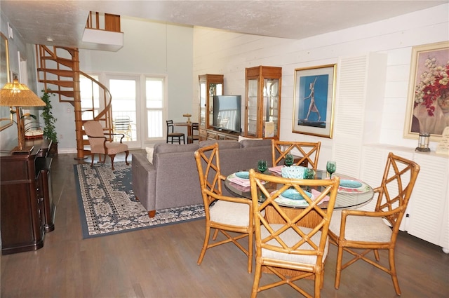 dining space featuring dark wood-type flooring