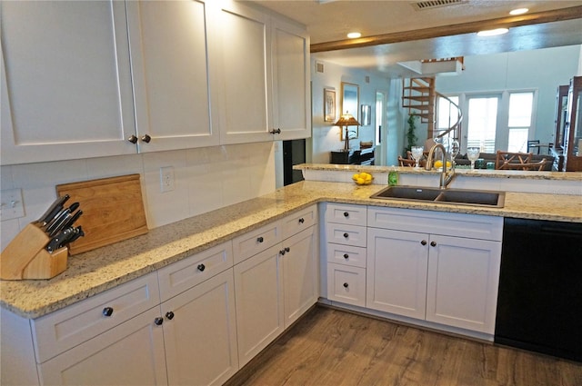 kitchen featuring kitchen peninsula, white cabinets, sink, wood-type flooring, and dishwasher