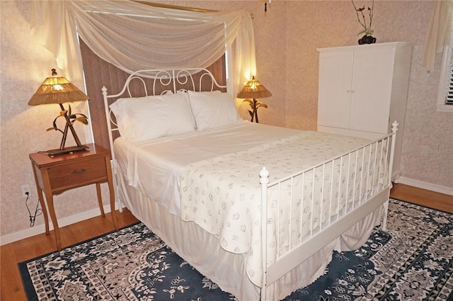 bedroom with wood-type flooring