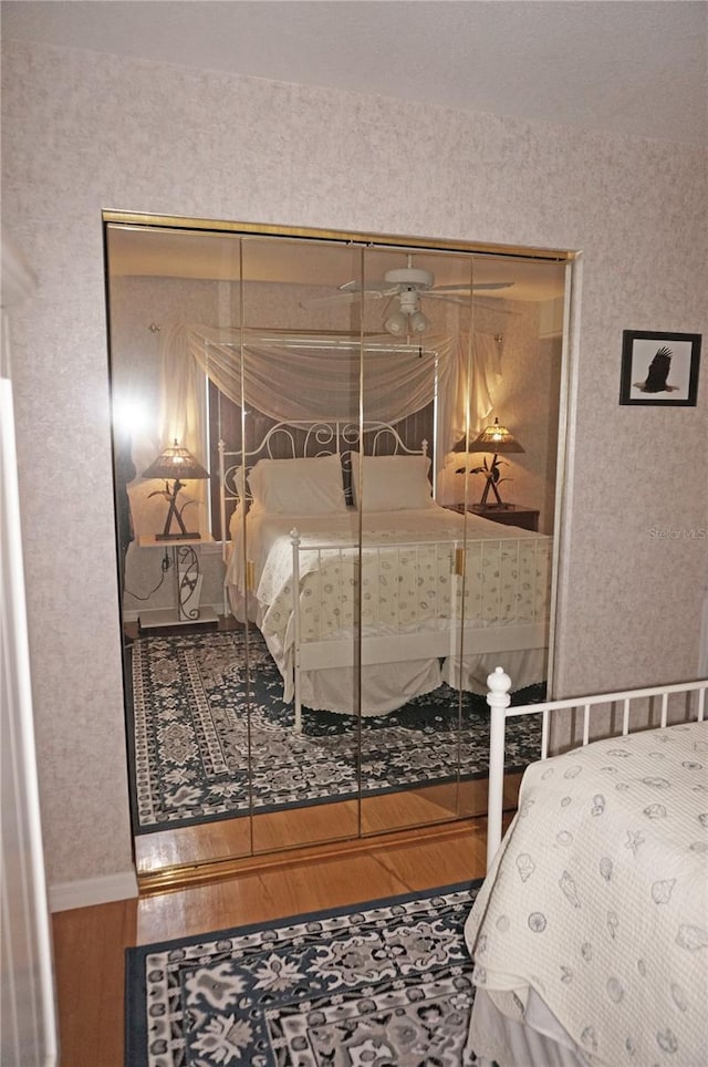 bedroom featuring a closet and hardwood / wood-style flooring