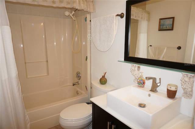 full bathroom with vanity, shower / bath combo, and toilet