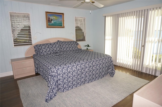 bedroom with ceiling fan and dark wood-type flooring