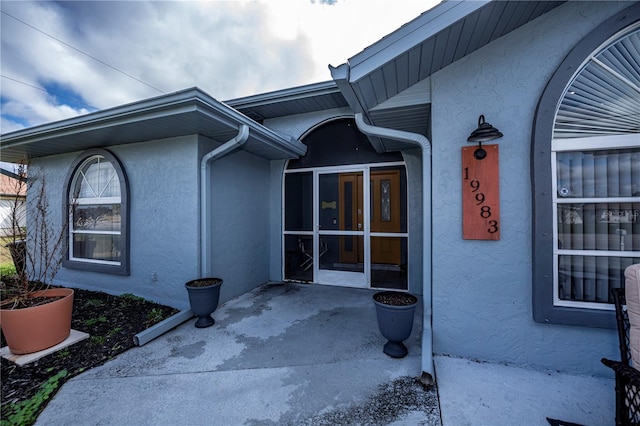 property entrance featuring french doors