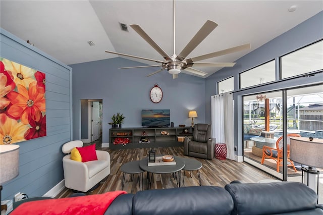 living room featuring ceiling fan, wood-type flooring, and lofted ceiling