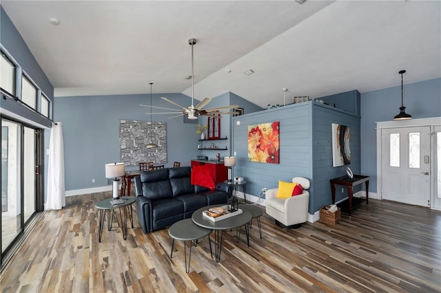 living room featuring hardwood / wood-style floors, ceiling fan, and lofted ceiling