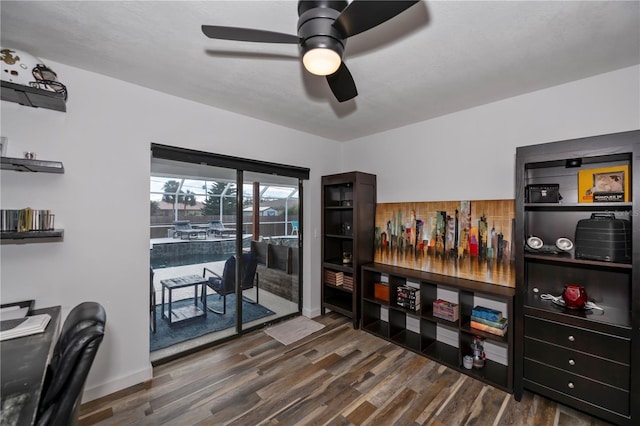 office area featuring ceiling fan and dark hardwood / wood-style flooring