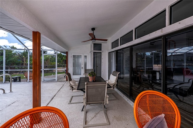 view of patio / terrace featuring glass enclosure and ceiling fan