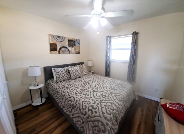 bedroom with ceiling fan and dark wood-type flooring