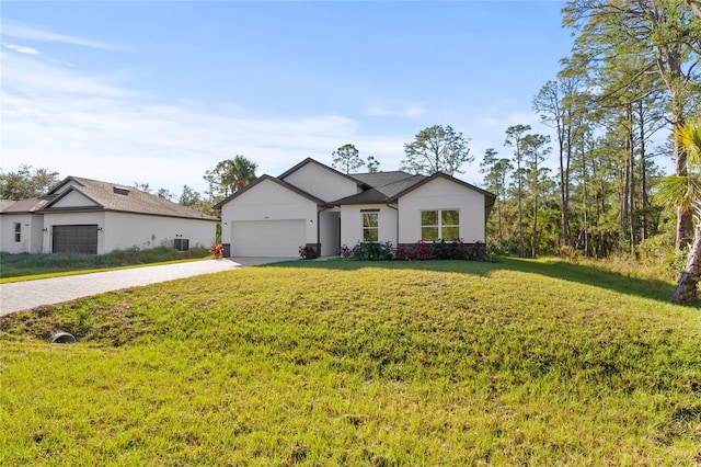 view of front of home with a front yard and a garage