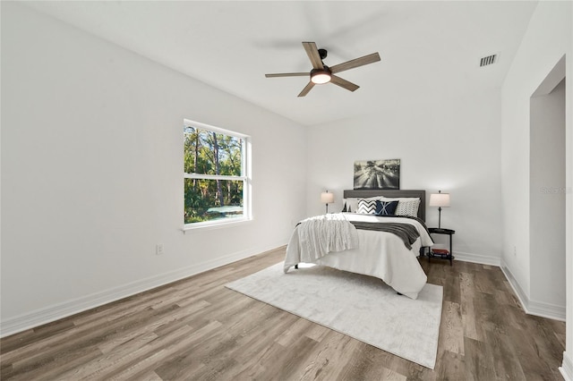 bedroom featuring hardwood / wood-style floors and ceiling fan