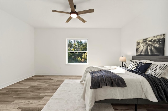 bedroom featuring ceiling fan and wood-type flooring