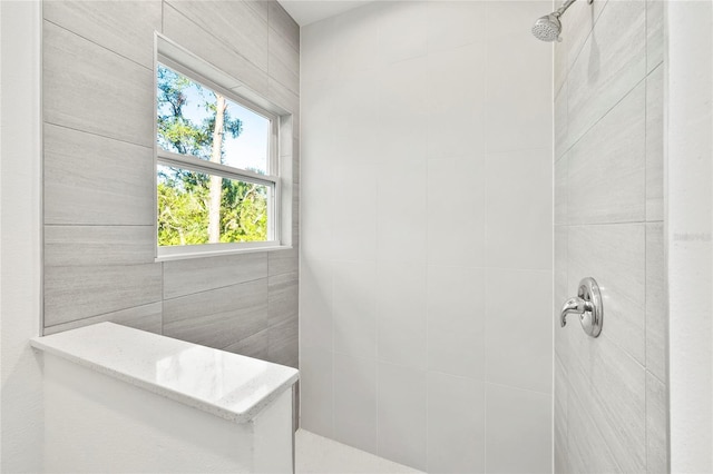 bathroom featuring tiled shower