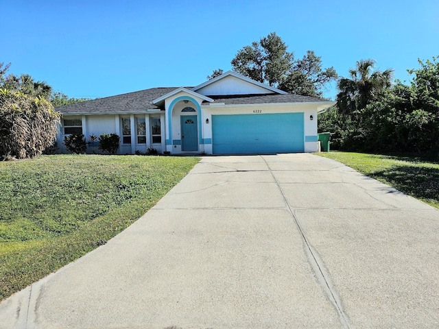 ranch-style house with a garage and a front lawn