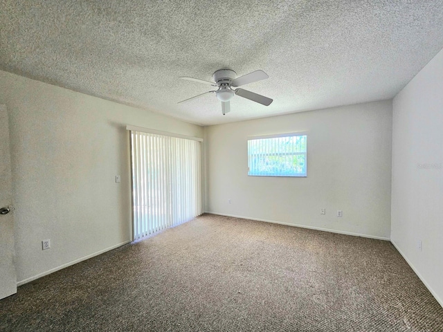 carpeted empty room with a textured ceiling and ceiling fan