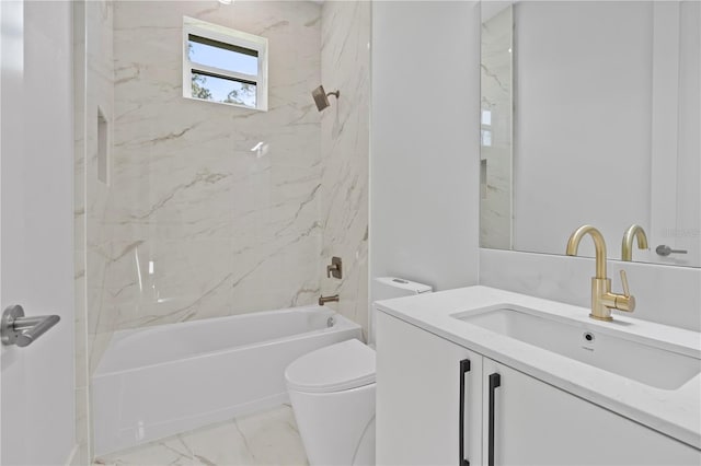 full bathroom with toilet, vanity, and tiled shower / bath