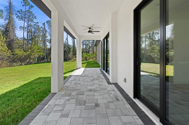 view of patio / terrace featuring ceiling fan