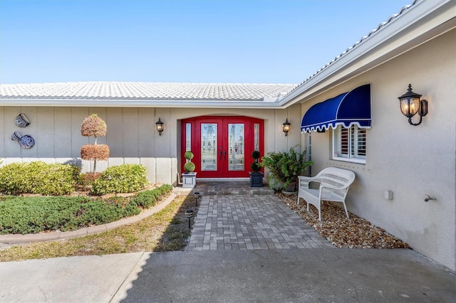 entrance to property featuring french doors