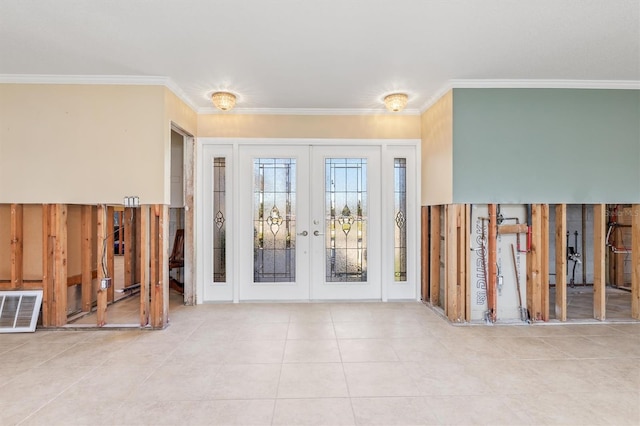 entryway featuring crown molding and french doors