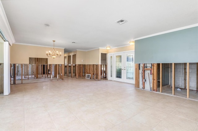 empty room featuring french doors, an inviting chandelier, and ornamental molding