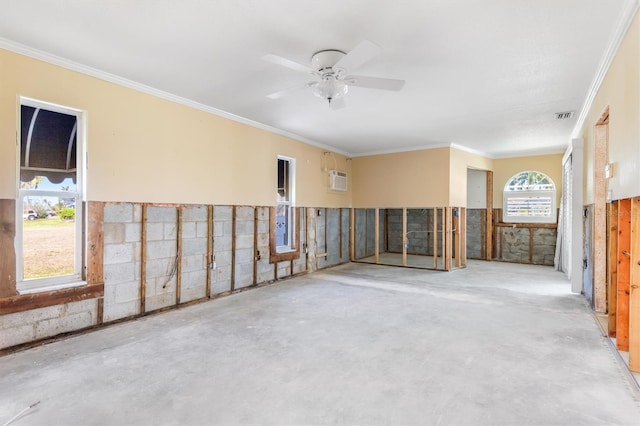 spare room featuring crown molding and ceiling fan