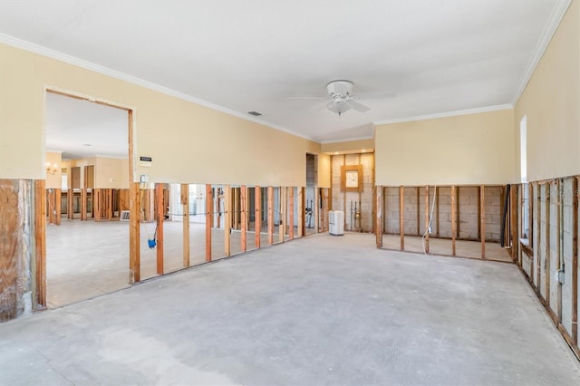 spare room featuring concrete flooring, ceiling fan, and ornamental molding