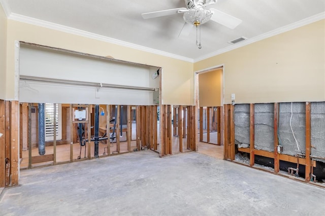 misc room with concrete flooring, ceiling fan, and ornamental molding