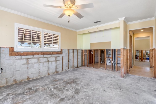 spare room featuring ceiling fan and crown molding