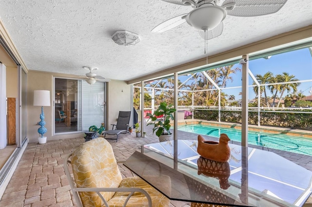 sunroom with ceiling fan and a healthy amount of sunlight