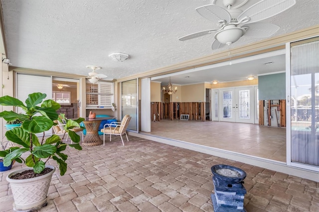 view of patio / terrace featuring ceiling fan and french doors