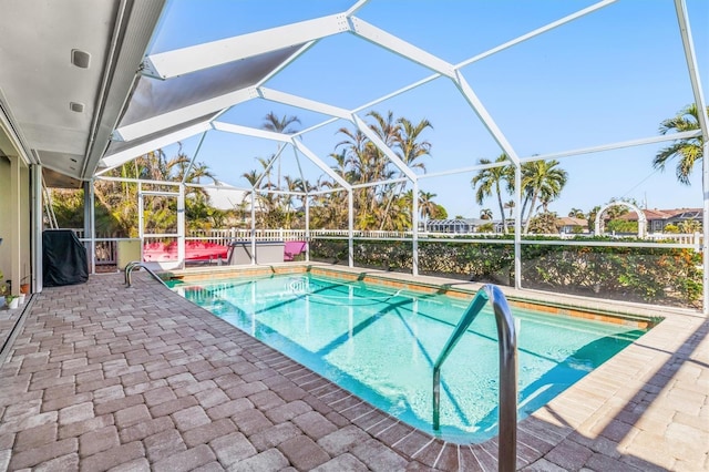 view of pool featuring a patio area and a lanai