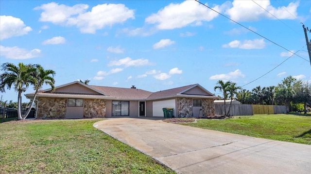 ranch-style home with a front yard and a garage