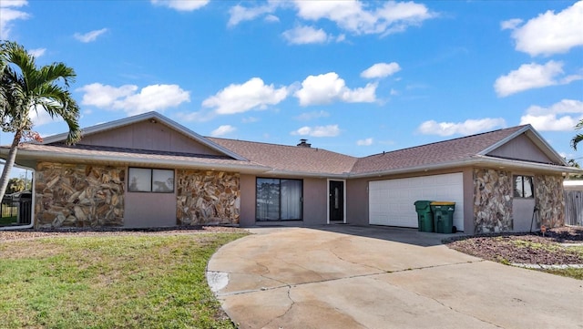 ranch-style home featuring a front yard and a garage