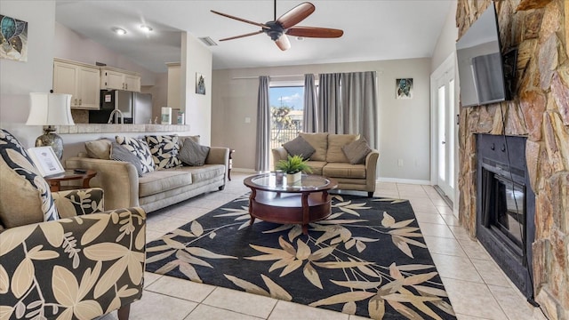 living room with light tile patterned flooring and vaulted ceiling