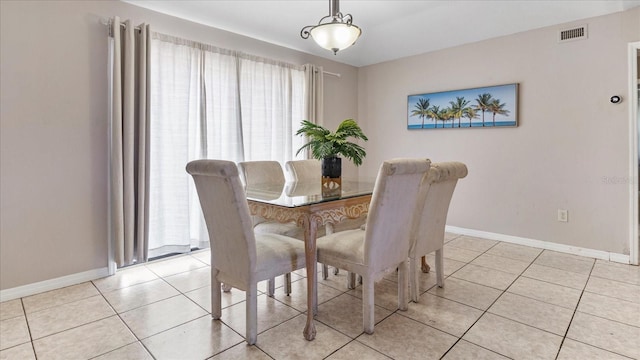 dining area featuring light tile patterned floors