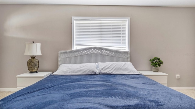 bedroom featuring light tile patterned flooring