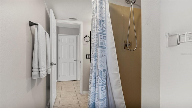 bathroom featuring a shower with shower curtain and tile patterned floors