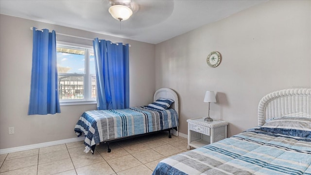 bedroom featuring ceiling fan and light tile patterned floors