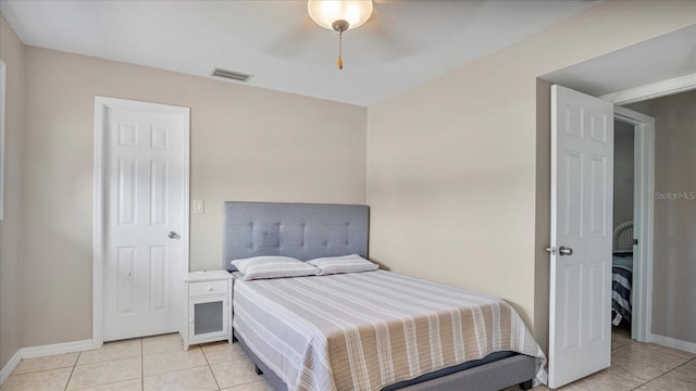 bedroom featuring light tile patterned floors