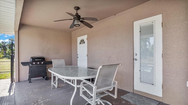 view of patio featuring a grill and ceiling fan