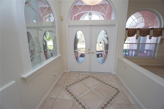 tiled entrance foyer with french doors