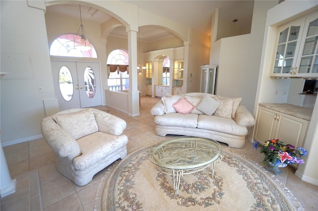 living room featuring french doors and light tile patterned floors