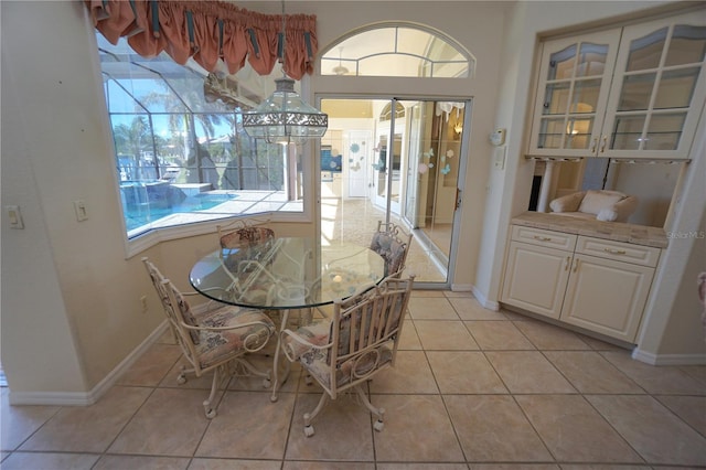 dining area featuring light tile patterned floors