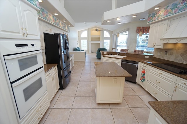 kitchen with dishwasher, white double oven, black electric stovetop, sink, and light tile patterned flooring