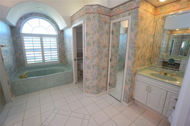 full bathroom featuring tile patterned flooring, vanity, toilet, and separate shower and tub