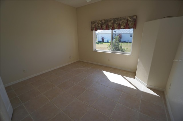 spare room with tile patterned flooring