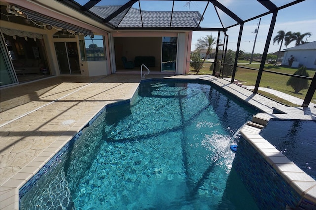 view of swimming pool with pool water feature, a lanai, and a patio