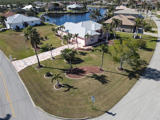 birds eye view of property featuring a water view